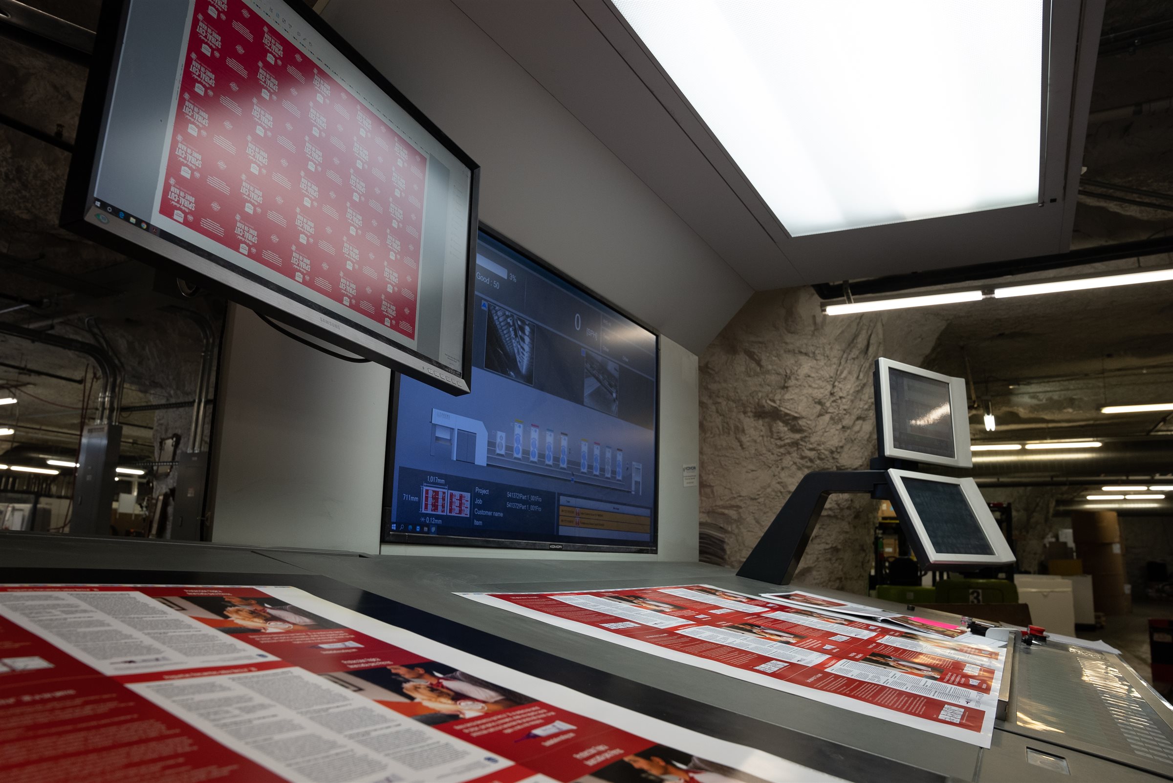 Red press sheets on a NextPage press console